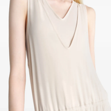 Close up of tan dress , showing texture of the Viscose and Elastane fabric