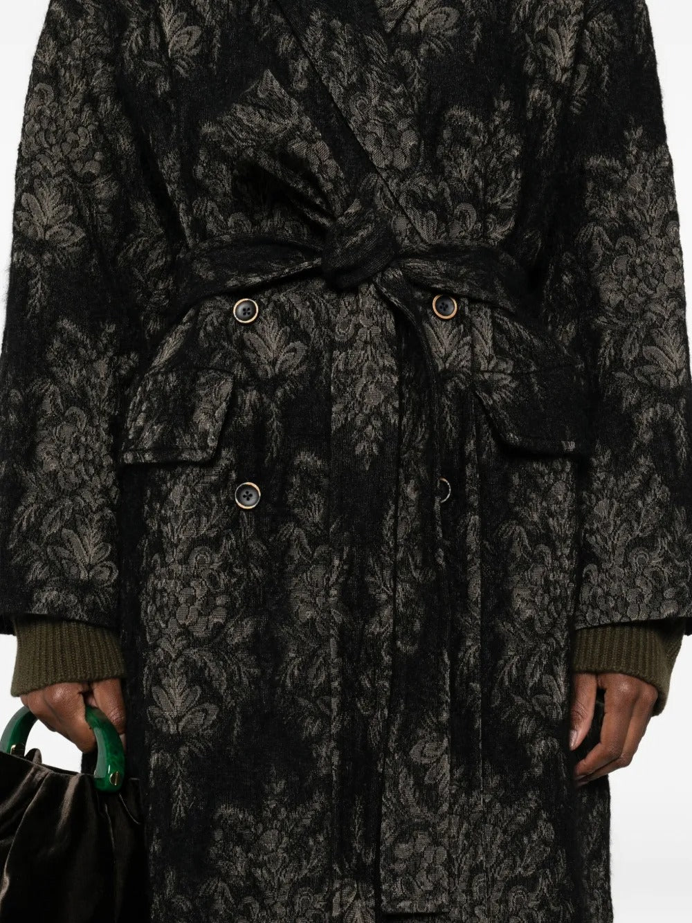 Close up of black coats, showing texture of the angora fabric