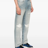 Blue jeans worn by a person, showing the jeans' fit