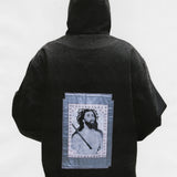 Black jacket worn by a person, showing the jacket's fit