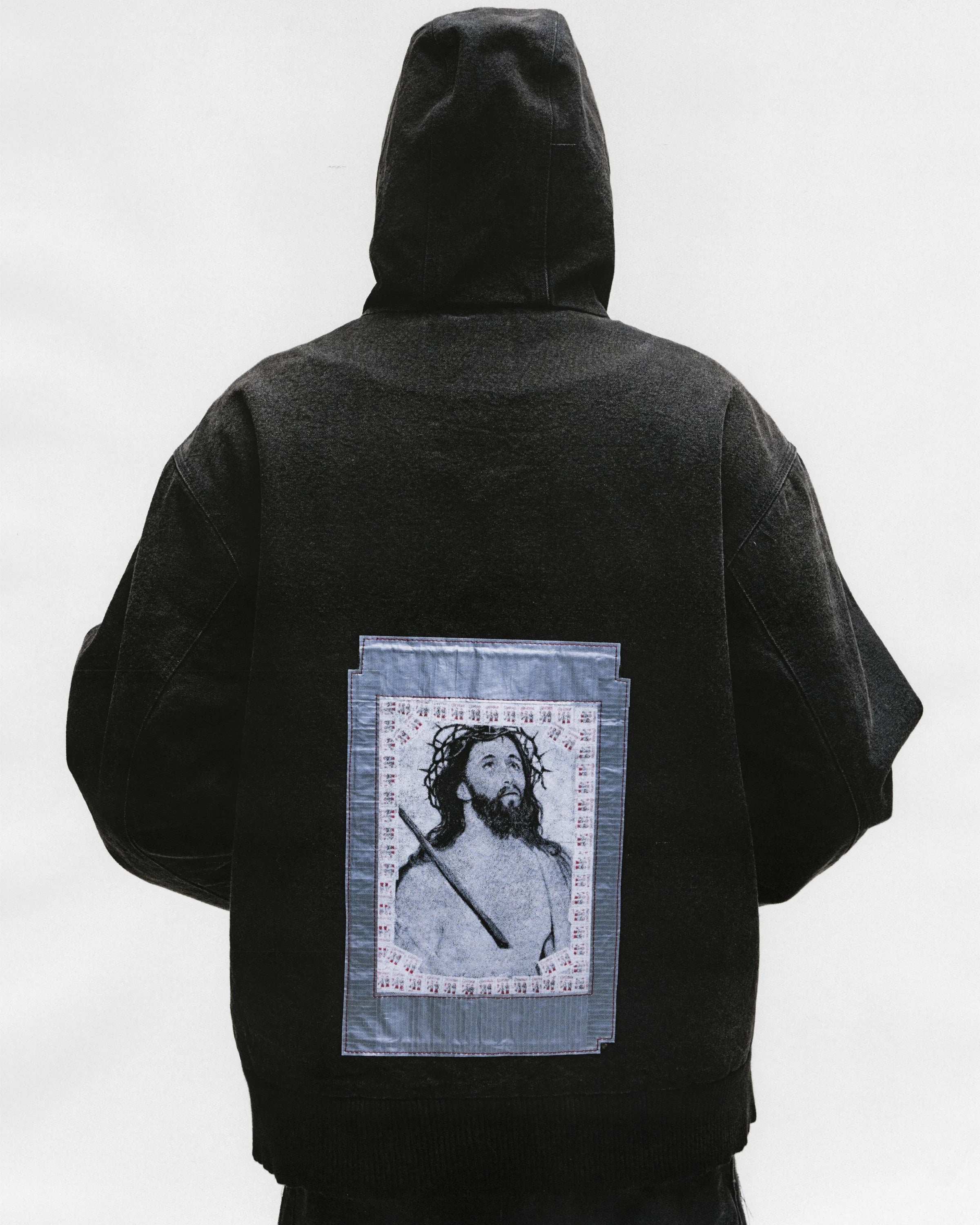 Black jacket worn by a person, showing the jacket's fit