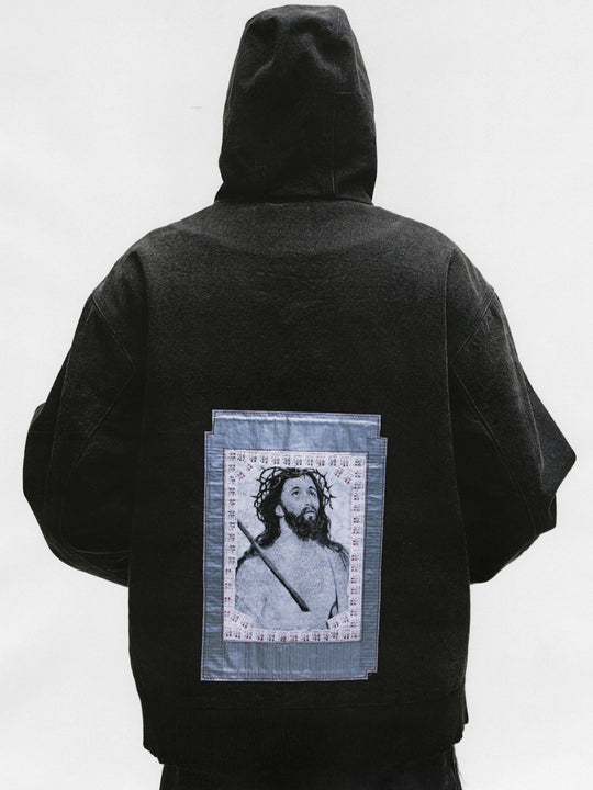 Black jacket worn by a person, showing the jacket's fit