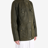 Green jacket worn by a person, showing the jacket fit