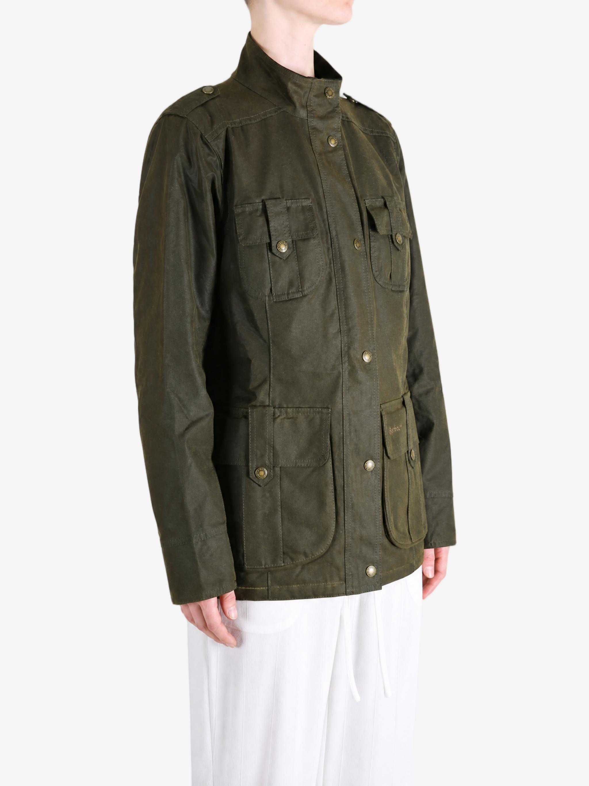 Green jacket worn by a person, showing the jacket fit