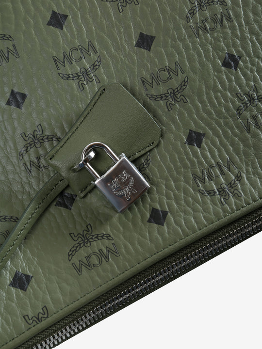 Close up of green bag, showing texture of the leather fabric
