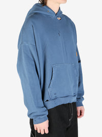 Navy sweatshirt worn by a person, showing the sweatshirt fit