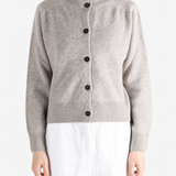 Grey knitwear worn by a person, showing the knitwear fit