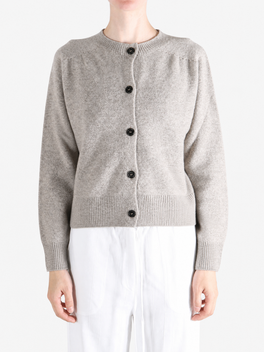 Grey knitwear worn by a person, showing the knitwear fit