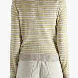 Yellow knitwear worn by a person, showing the knitwear fit