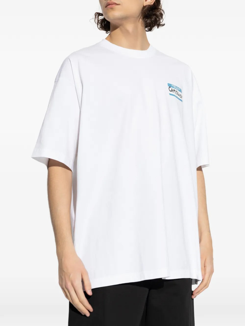 White t-shirt worn by a person, showing the shirt's fit