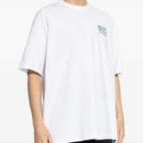 White t-shirt worn by a person, showing the shirt's fit