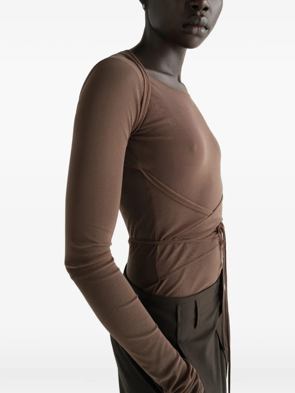 Brown top worn by a person, showing the top fit