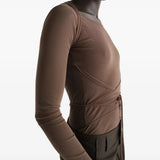 Brown top worn by a person, showing the top fit