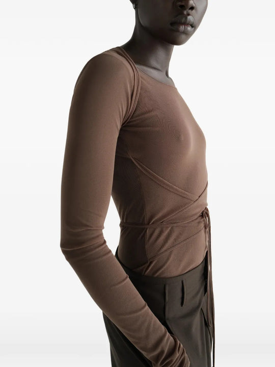 Brown top worn by a person, showing the top fit