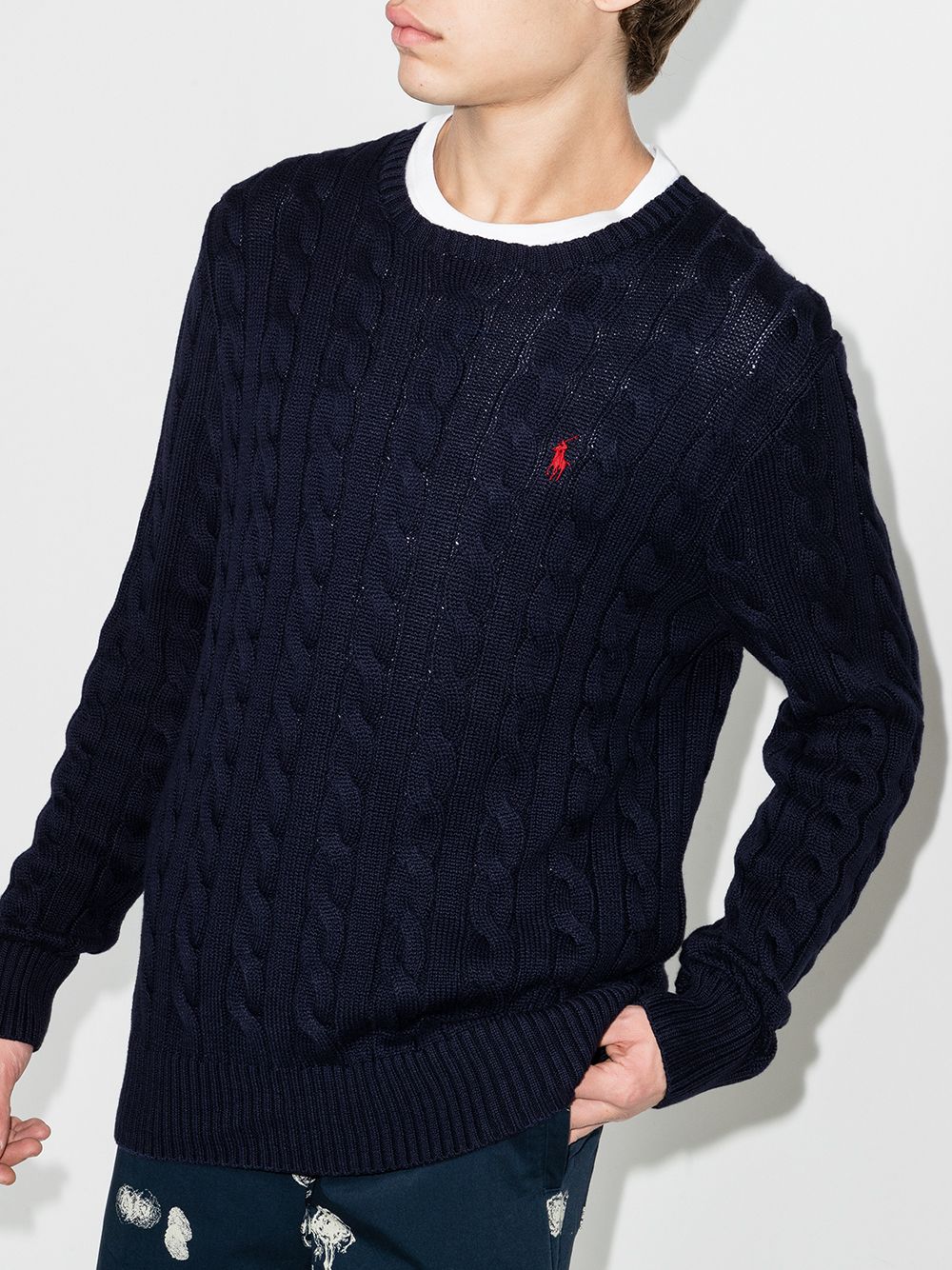 Navy pullover worn by a person, showing the pullover's fit