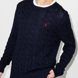 Navy pullover worn by a person, showing the pullover's fit