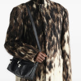 Black bag worn by a person, showing the bag fit