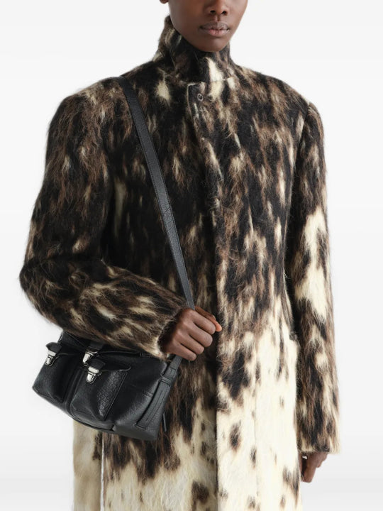 Black bag worn by a person, showing the bag fit