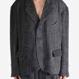 Black shirt worn by a person, showing the shirt's fit