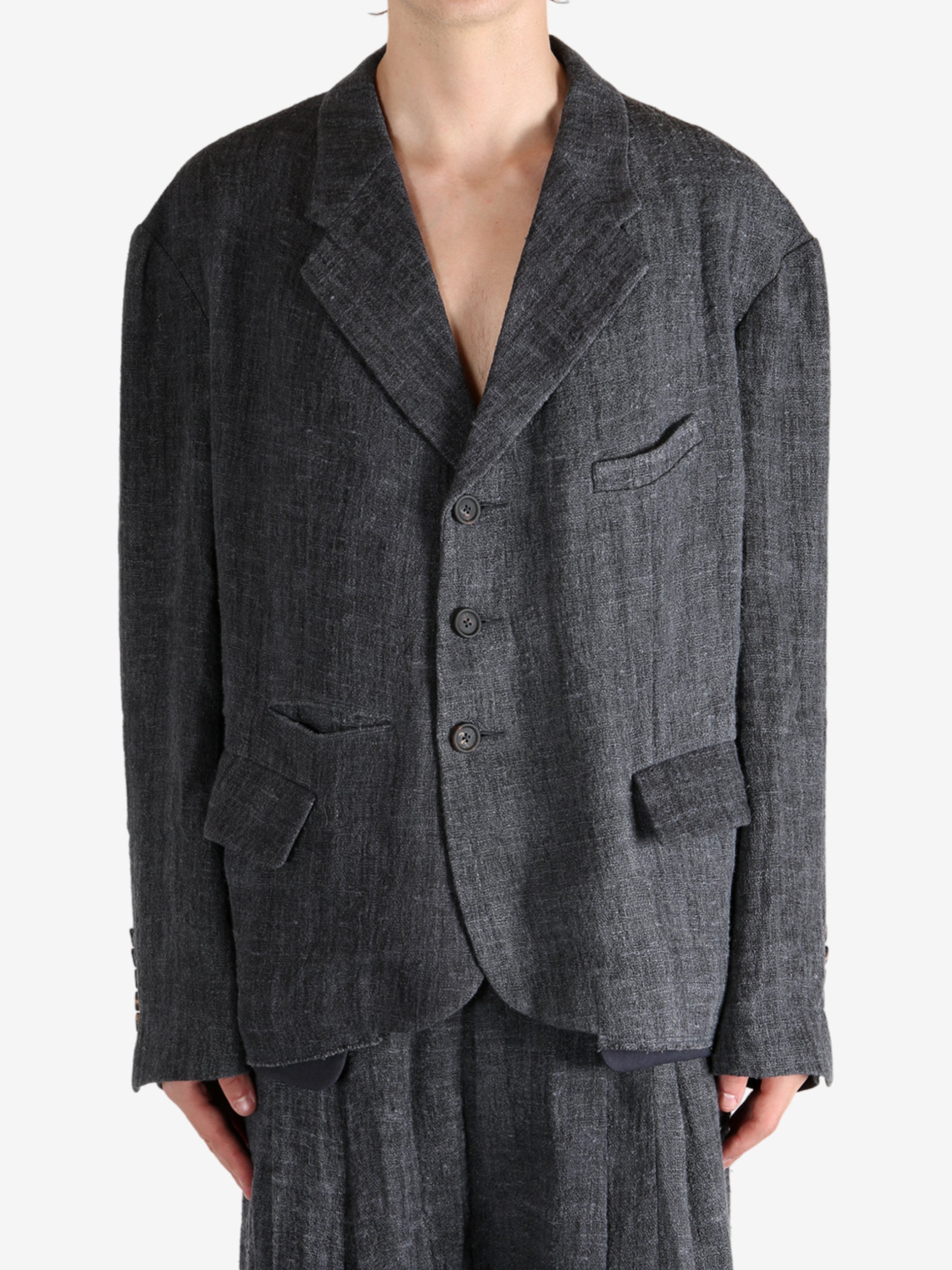 Black shirt worn by a person, showing the shirt's fit