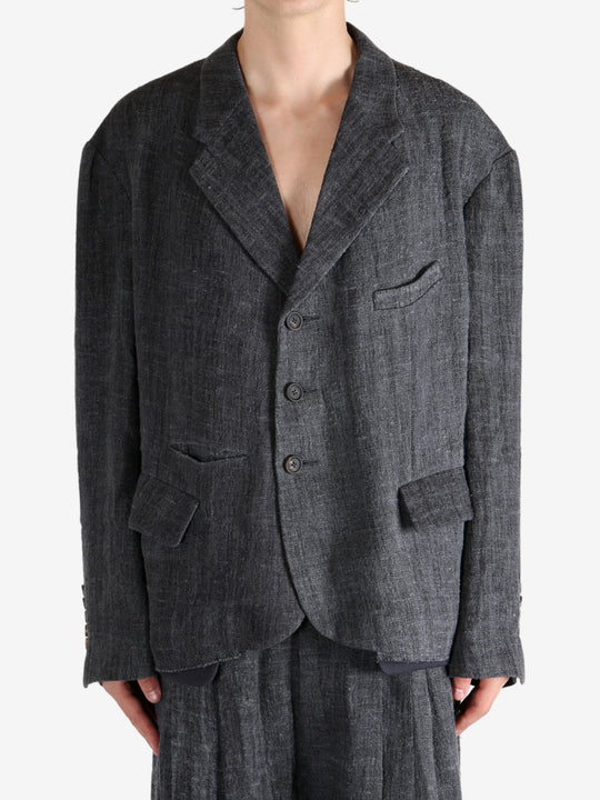 Black shirt worn by a person, showing the shirt's fit