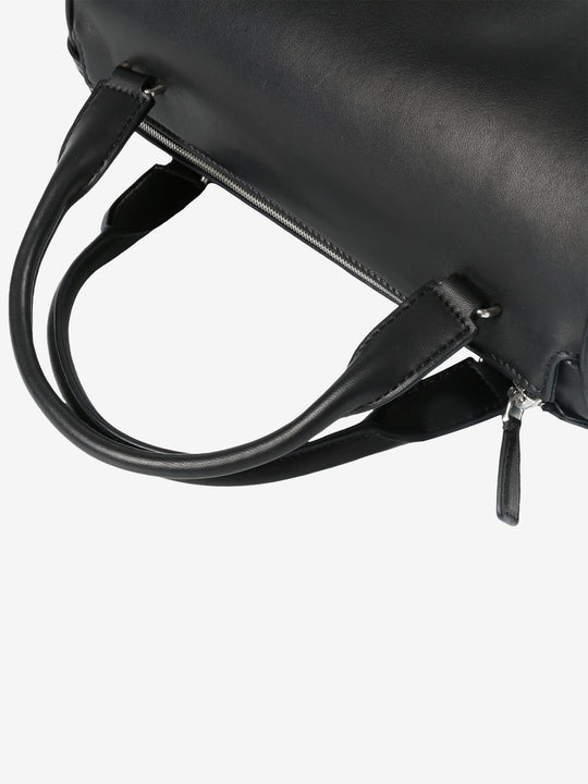 Close up of black bag, showing texture of the leather fabric