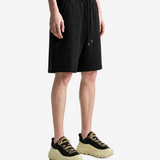 Black shorts worn by a person, showing the shorts fit