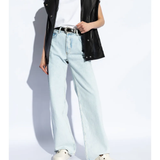 White sandals worn by a person, showing the sandals fit