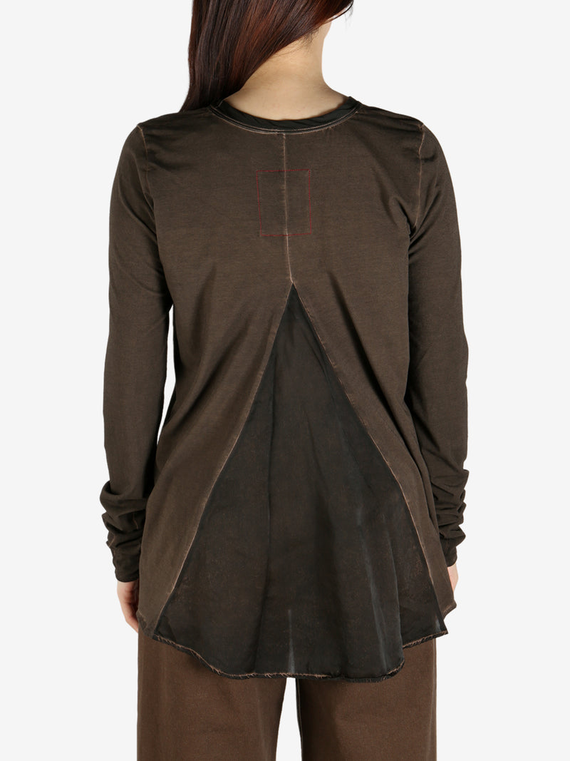 Brown top worn by a person, showing the top's fit
