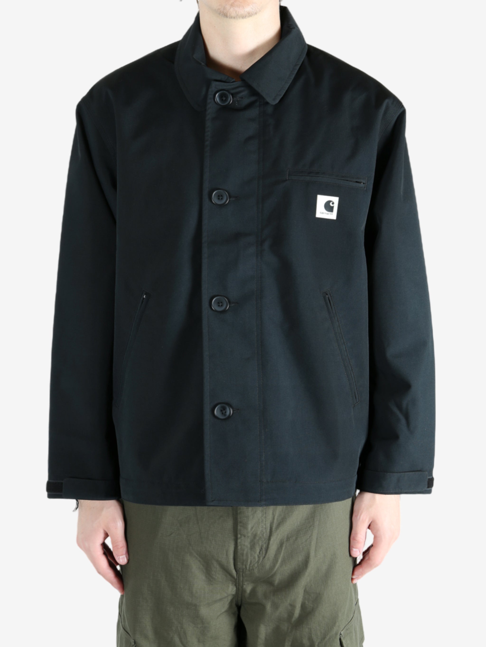 Black jacket worn by a person, showing the jacket's fit