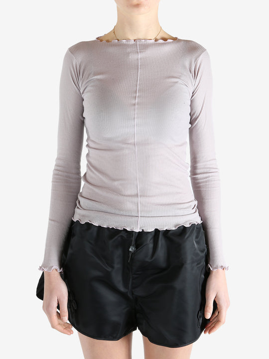 Purple t-shirt worn by a person, showing the shirt's fit