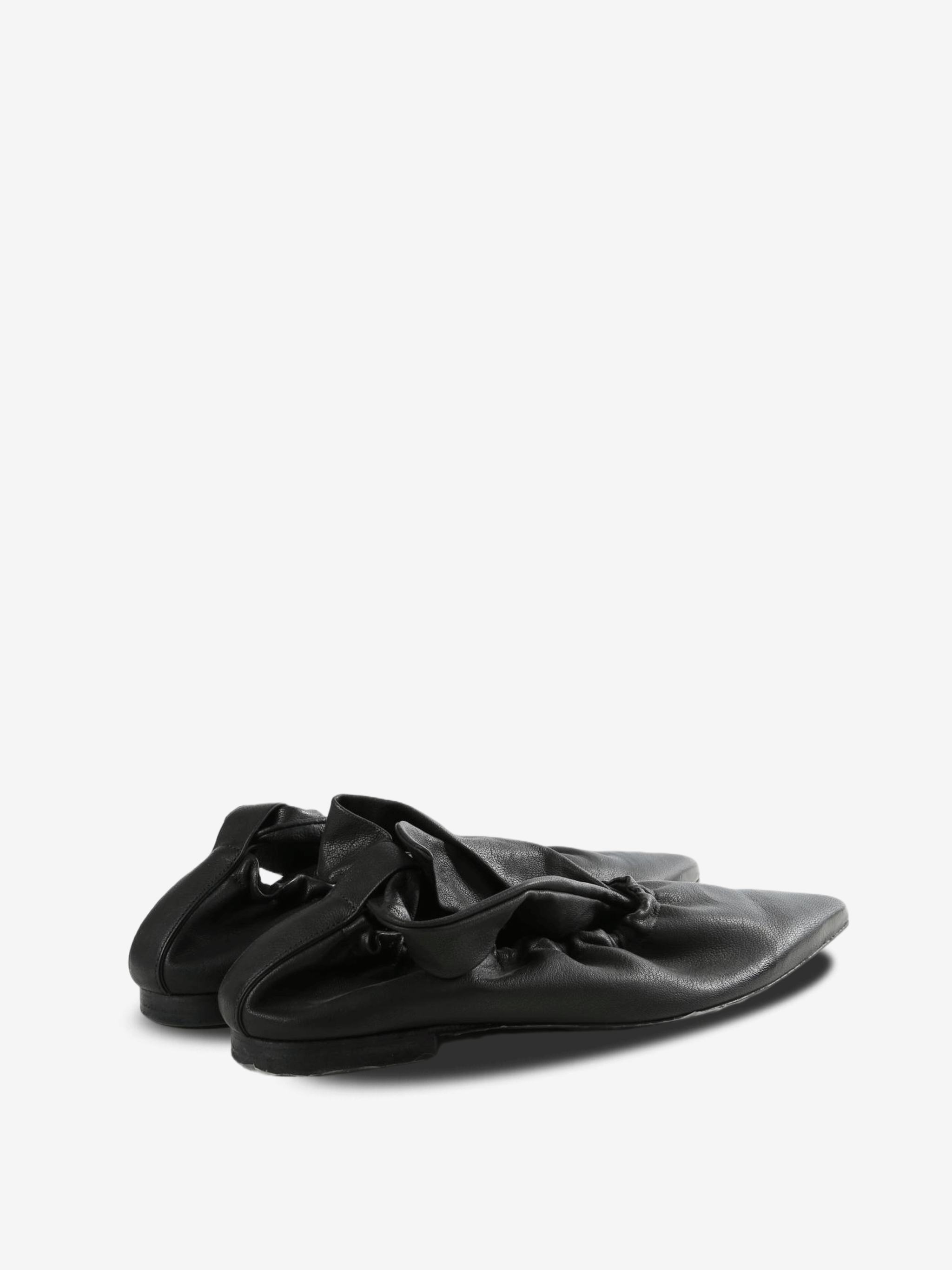 Black sneakers, back view