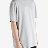 Grey t-shirts worn by a person, showing the t-shirts fit