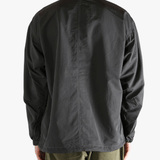 Black jacket worn by a person, showing the  jacket's fit