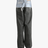 Black jeans worn by a person, showing the jeans fit