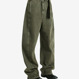 Green pants worn by a person, showing the pants fit