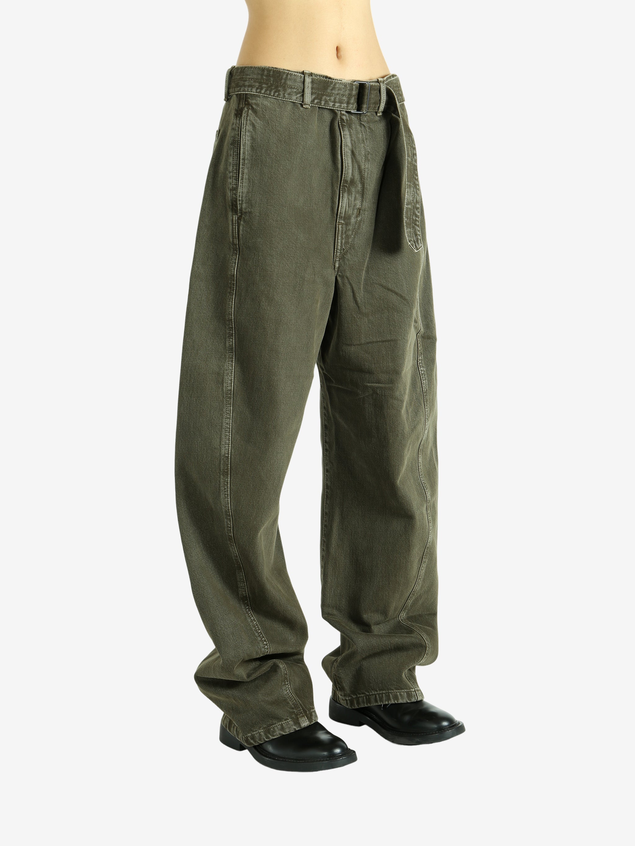 Green pants worn by a person, showing the pants fit