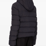 Black jacket worn by a person, showing the jacket's fit