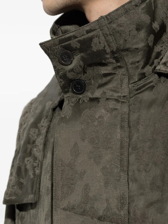 Green jacket worn by a person, showing the jacket fit