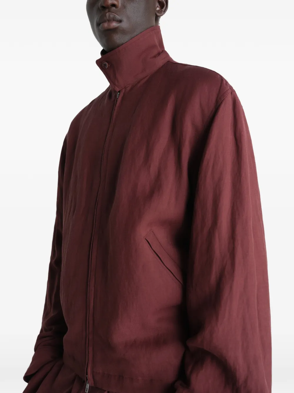 Close up of red jacket, showing texture of the viscose fabric