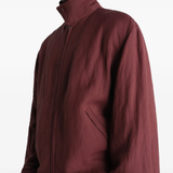 Close up of red jacket, showing texture of the viscose fabric