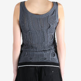 Blue tops worn by a person, showing the tops fit