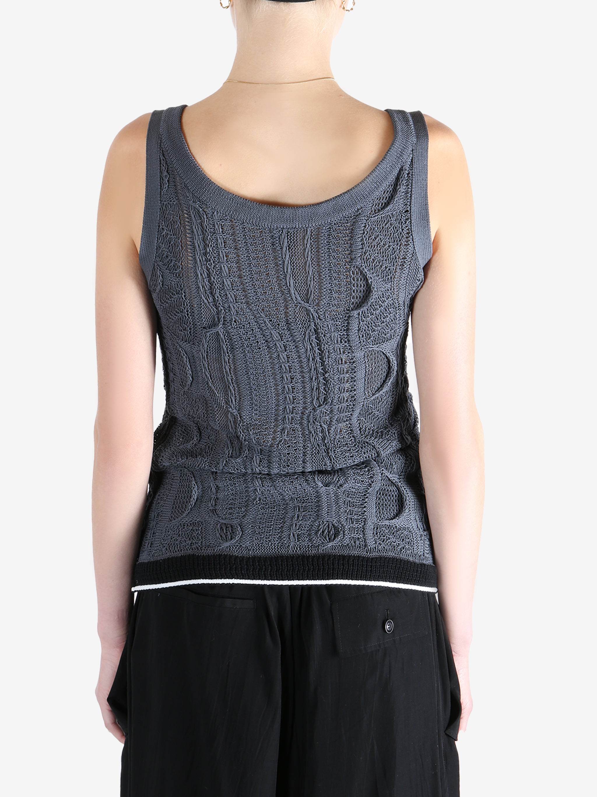 Blue tops worn by a person, showing the tops fit