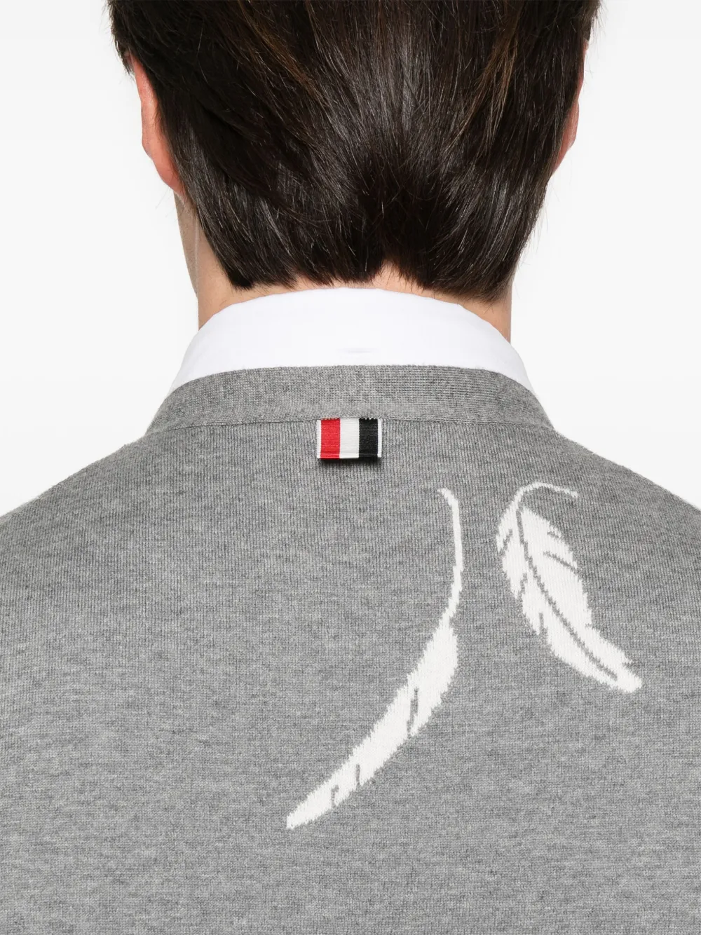 Close up of grey knitwear, showing texture of the cotton fabric