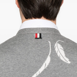 Close up of grey knitwear, showing texture of the cotton fabric