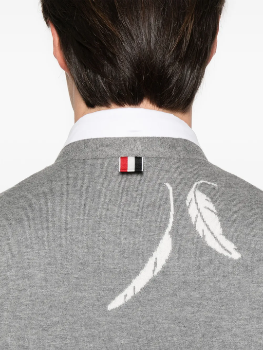 Close up of grey knitwear, showing texture of the cotton fabric