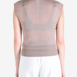 Brown top worn by a person, showing the top fit