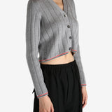 Grey knitwear worn by a person, showing the knitwear's fit