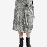 White skirts worn by a person, showing the skirts fit