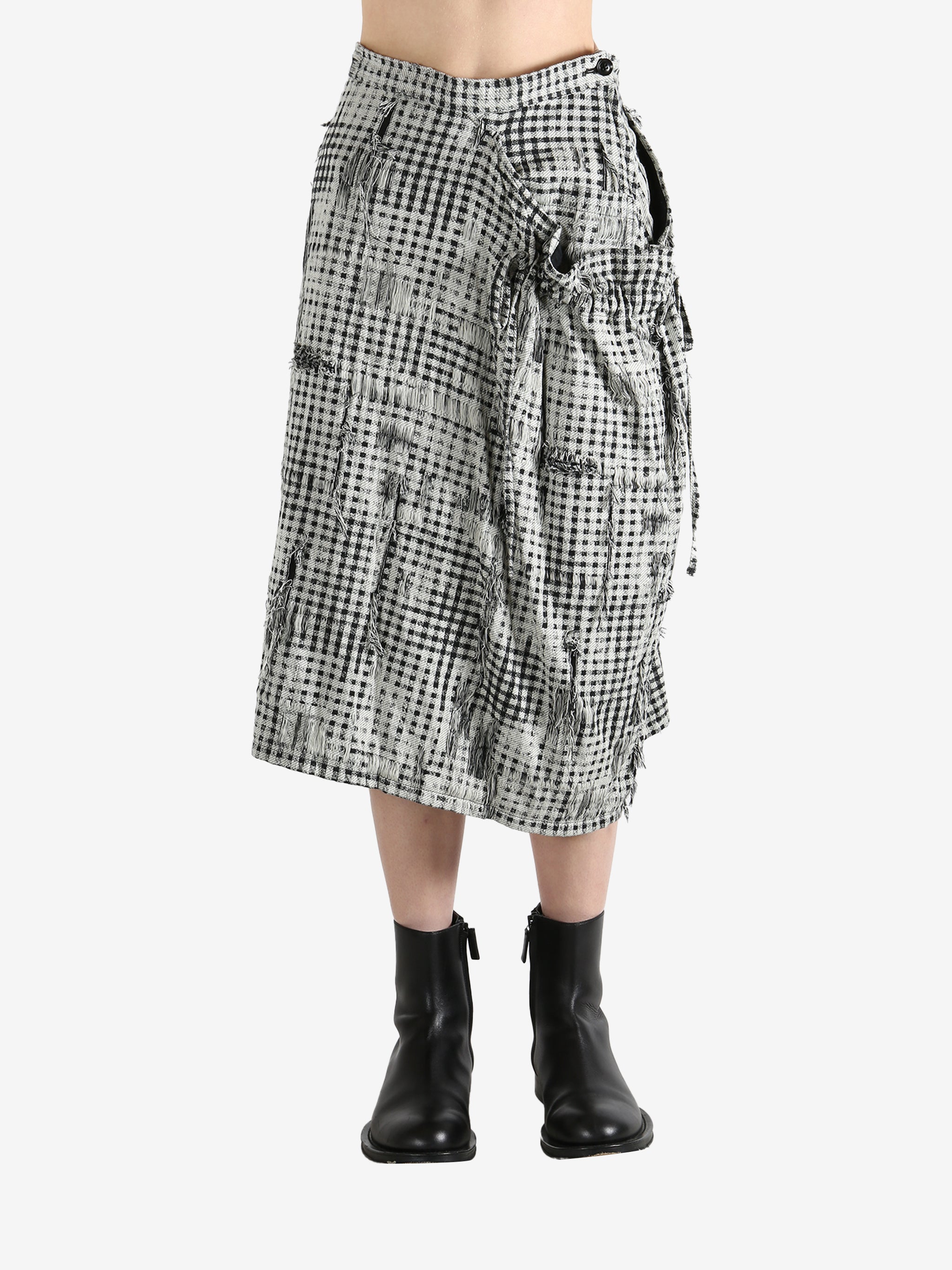 White skirts worn by a person, showing the skirts fit